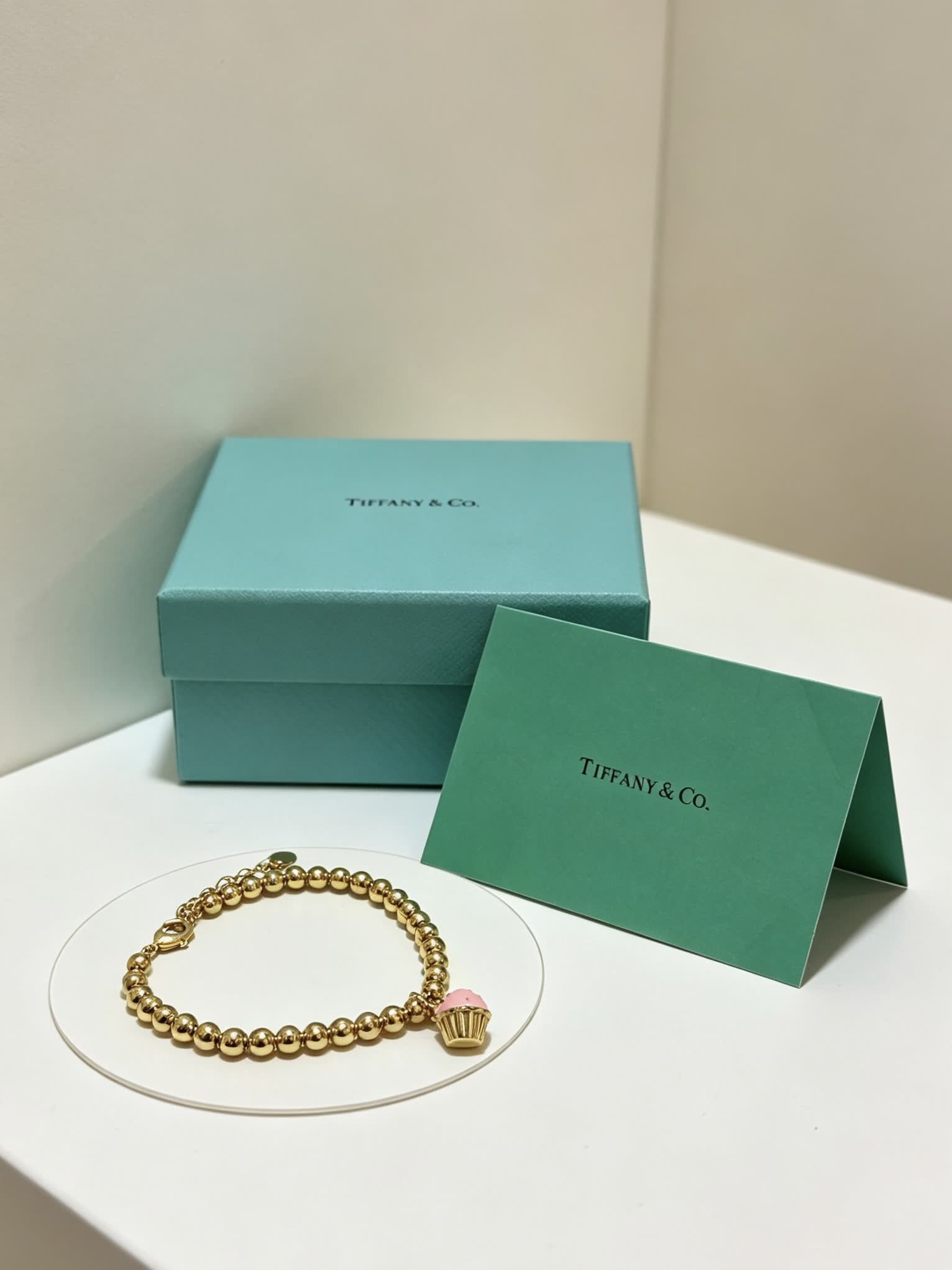 Tiffany & Co. Gold Bead Bracelet with Cupcake Charm